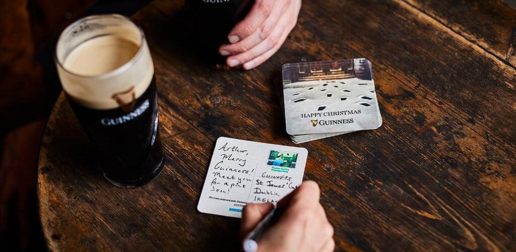Guinness distributes postcard coasters in Irish pubs