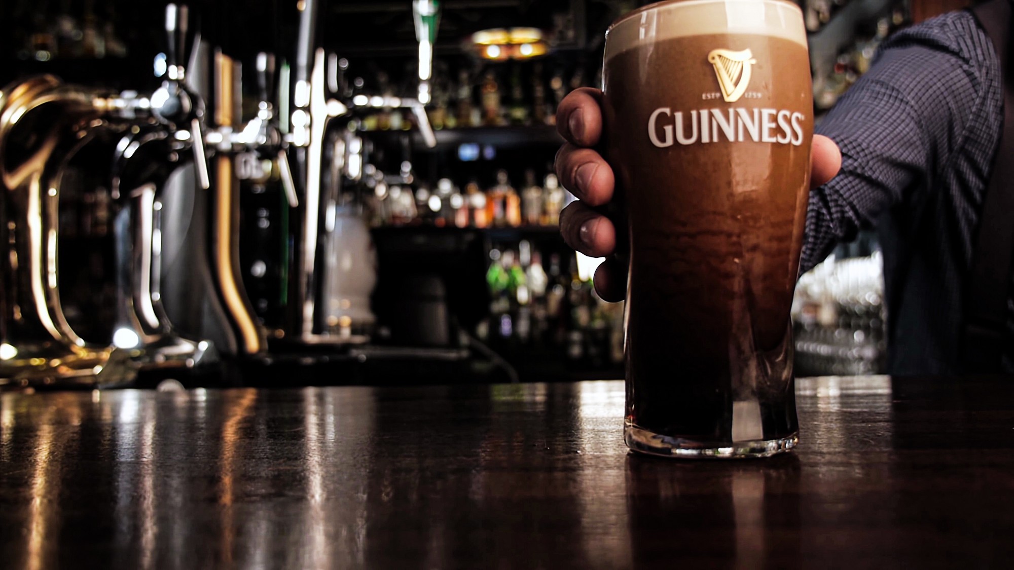 Galway an Irish pub offers free pints of Guinness, provided you win a