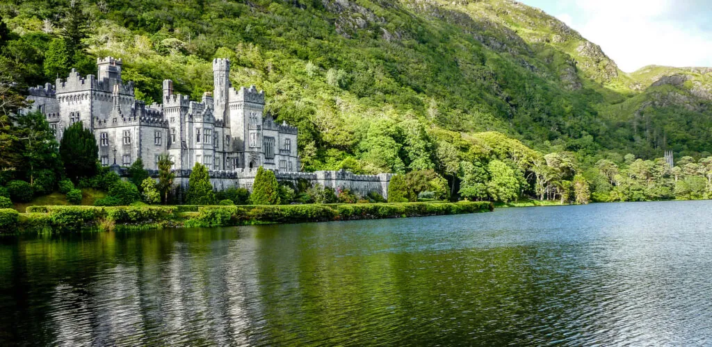 Kylemore Abbey lights up green to celebrate St. Patrick’s Day and 100 years of the Benedictine Order