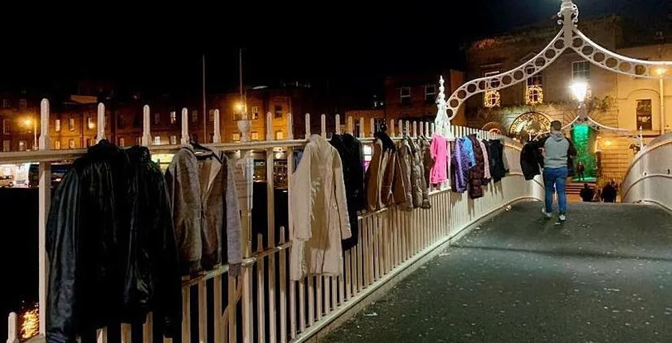 Dublin: residents hang coats from the Ha’Penny Bridge for the homeless