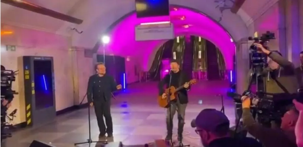 Bono and The Edge give a concert in a metro station in Kiev